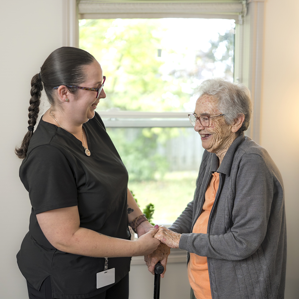Resident receiving personalized support from a caregiver at Atrium Retirement Residence in Orillia through Select Care services